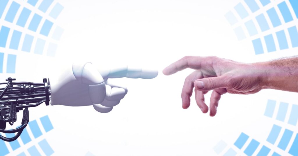 Una mà d'un robot i una mà d'un humà a punt de tocar-se